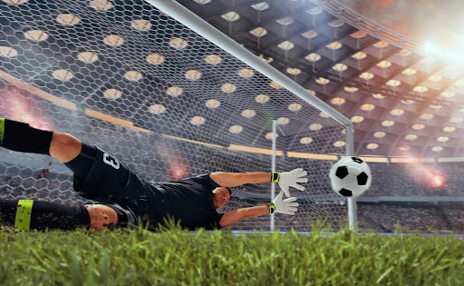 soccer-goalie-blocking-soccer-ball