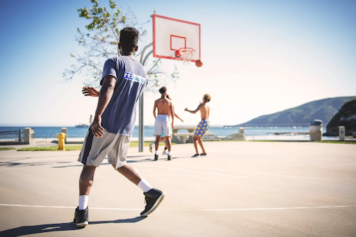 3-guys-playing-basketball-on-outdoor-court