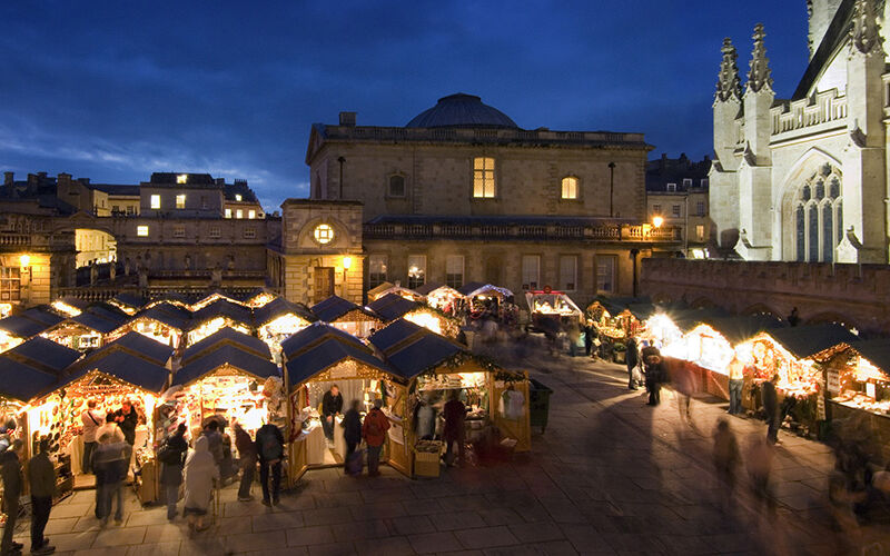Christmas-shops-outside-beautiful-building-lit-up-at-night