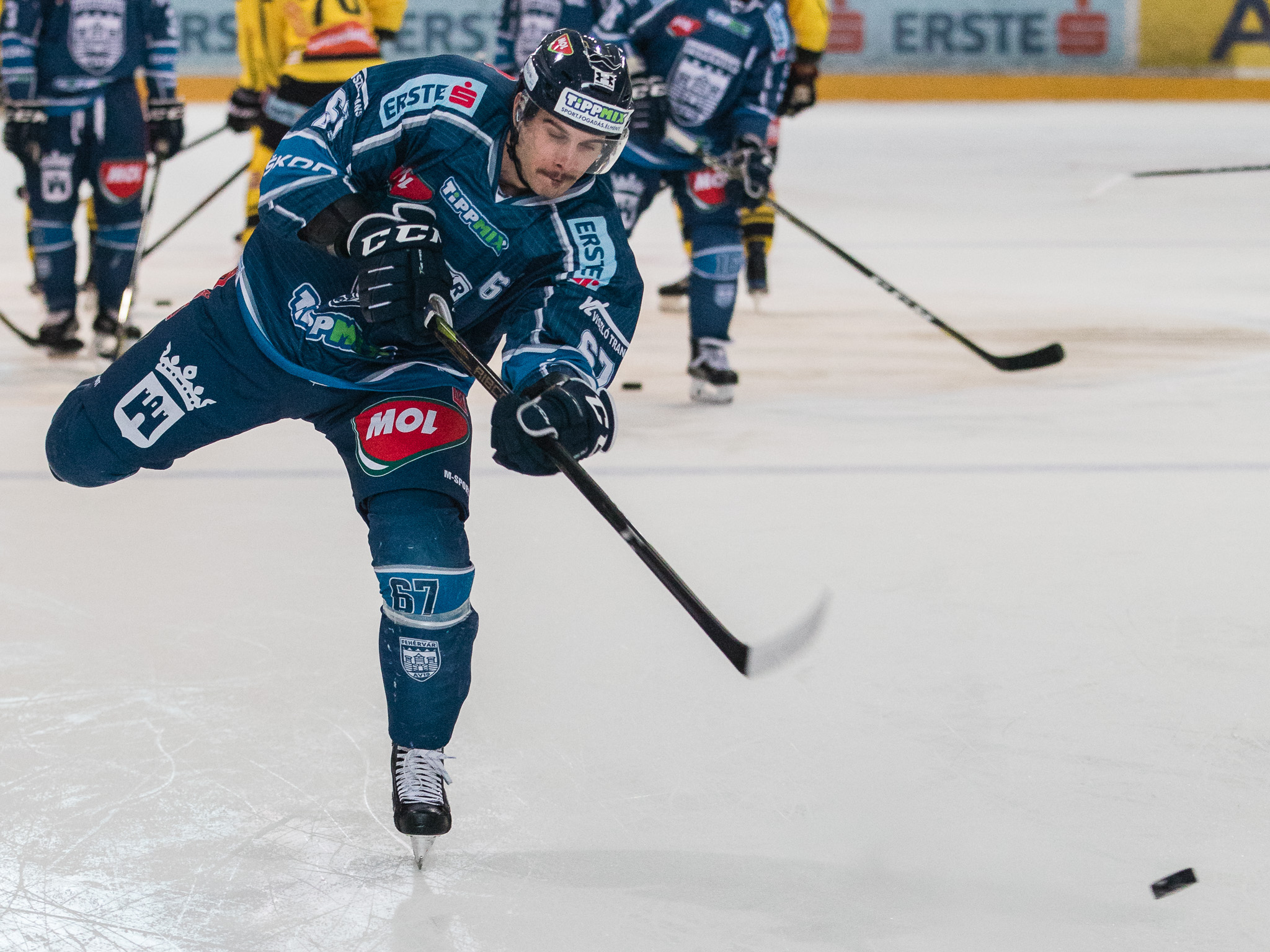 David-Gilbert-hitting-puck-on-ice-hockey-rink