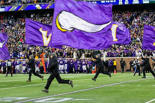 band-holding-viking-flags-across-field
