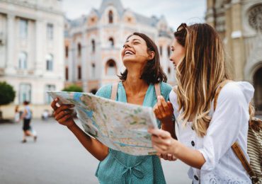 buddies-traveling-together-looking-at-map