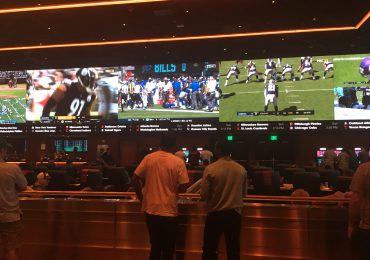 men-watching-games-at-casino