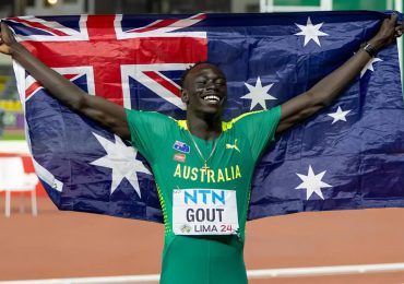 Australian-sprinter-holding-flag