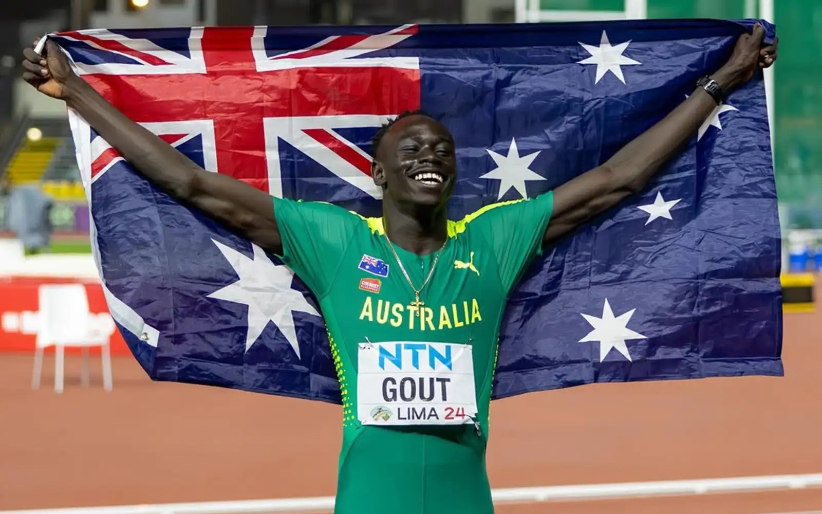 Australian-sprinter-holding-flag