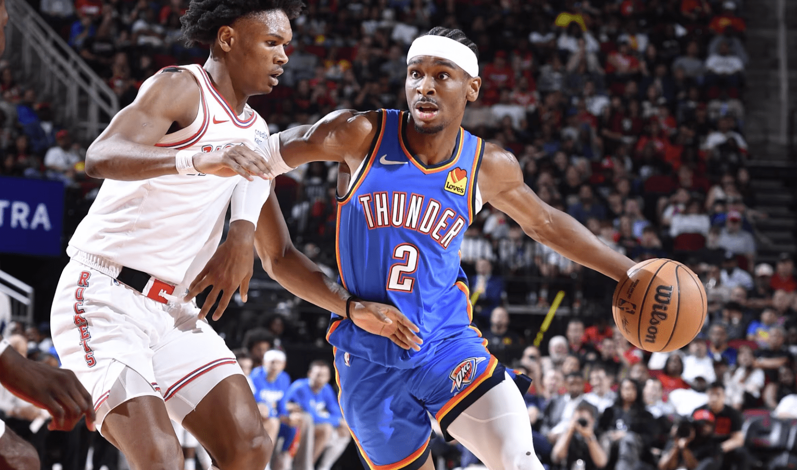 thunder-bball-player-dribbling-past-opponent