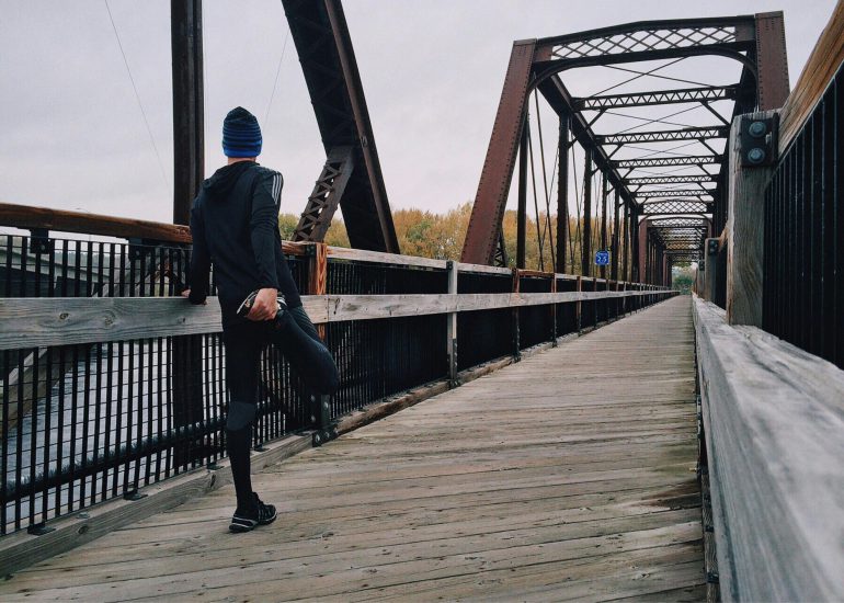 athlete-stretching-leg-during-run